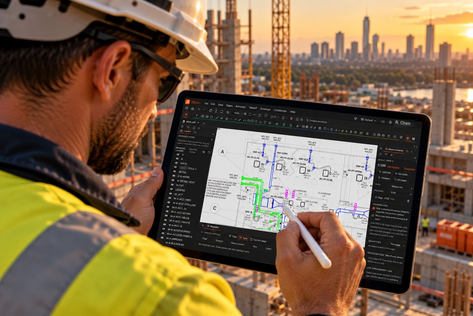 Engineer marking up a mechanical drawing in thiran on a tablet on site